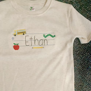Notebook Paper School Name Embroidered Tee